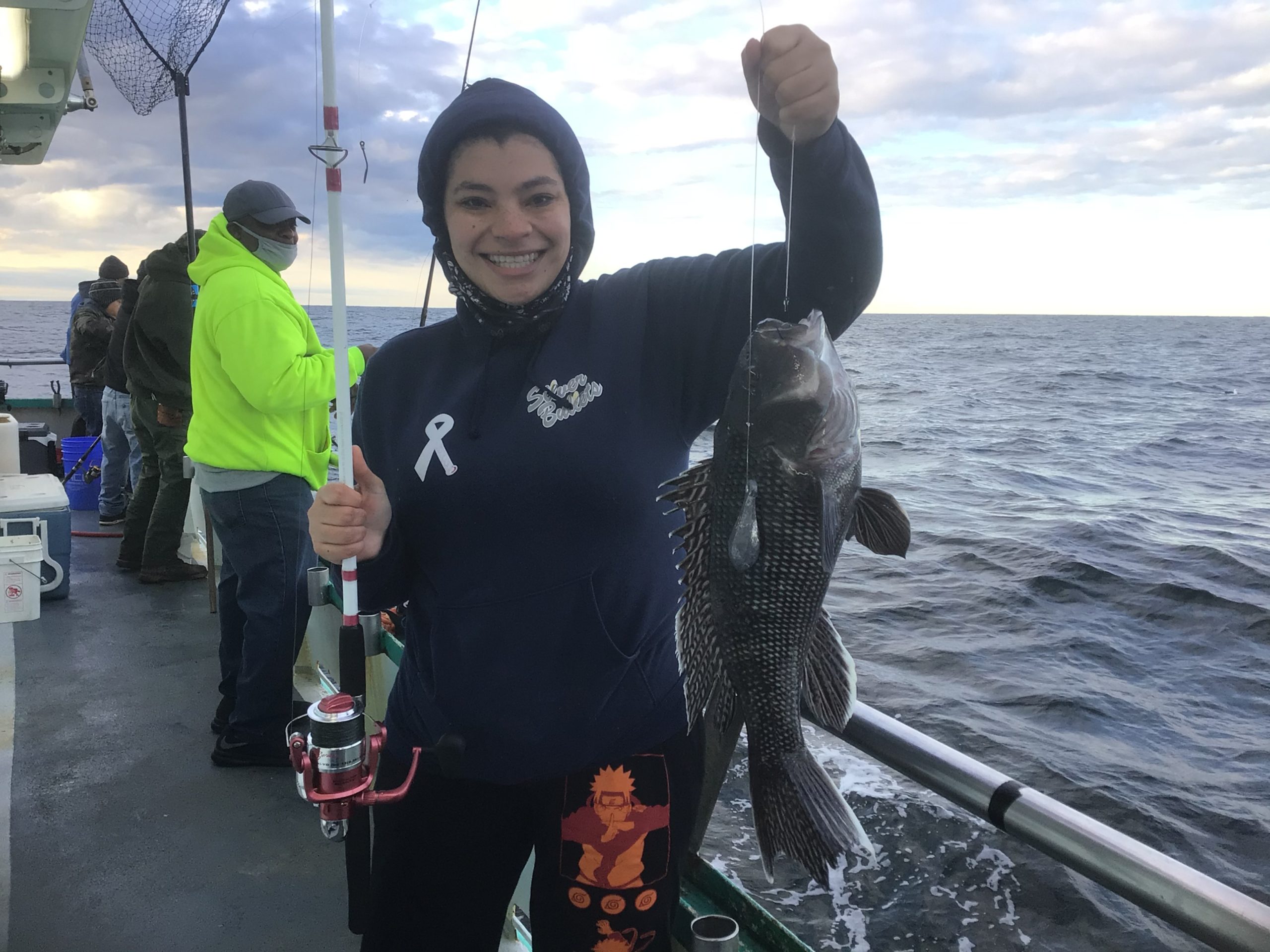 a couple of people that are standing in the water