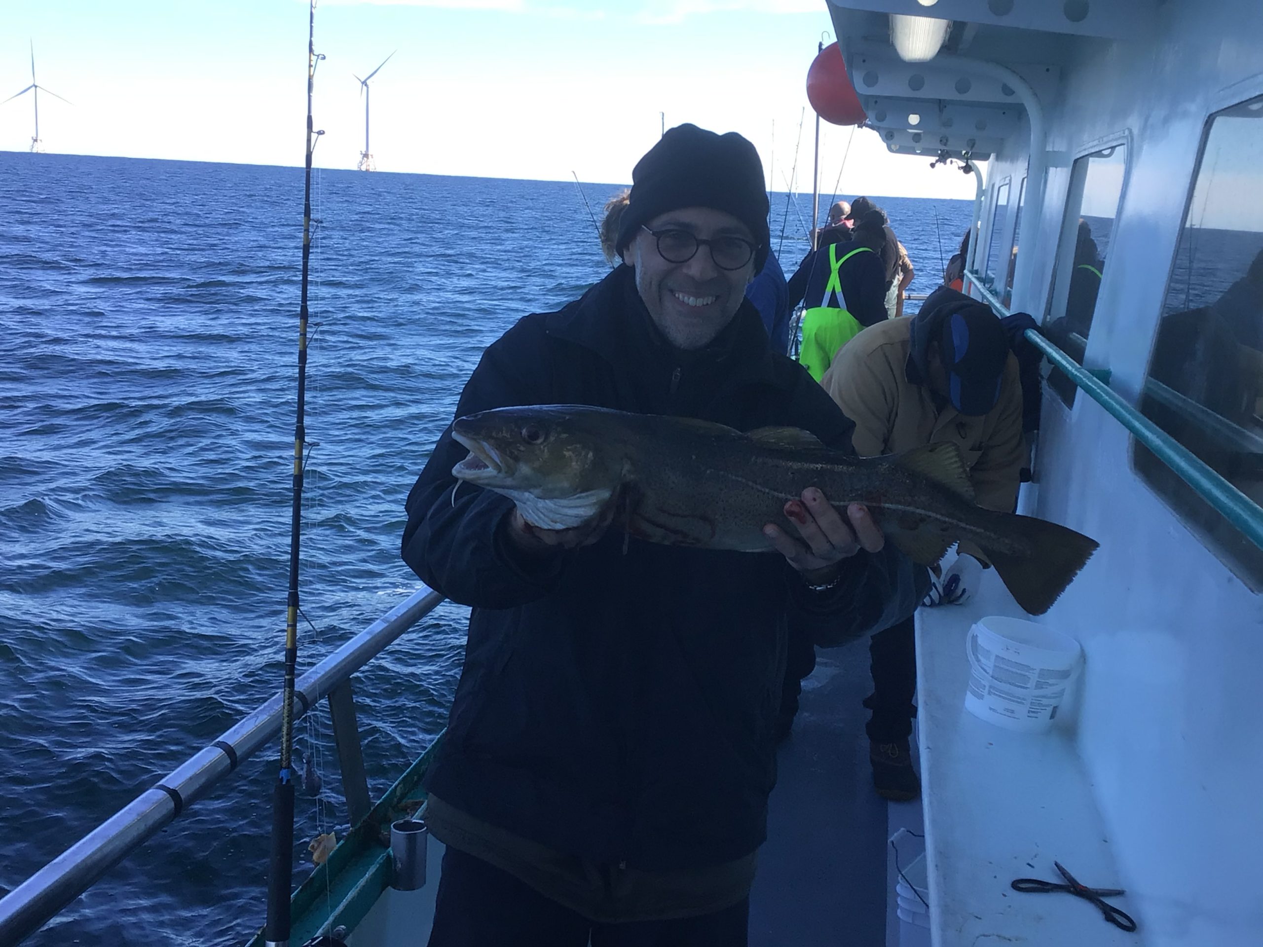 a person holding a fish in the water