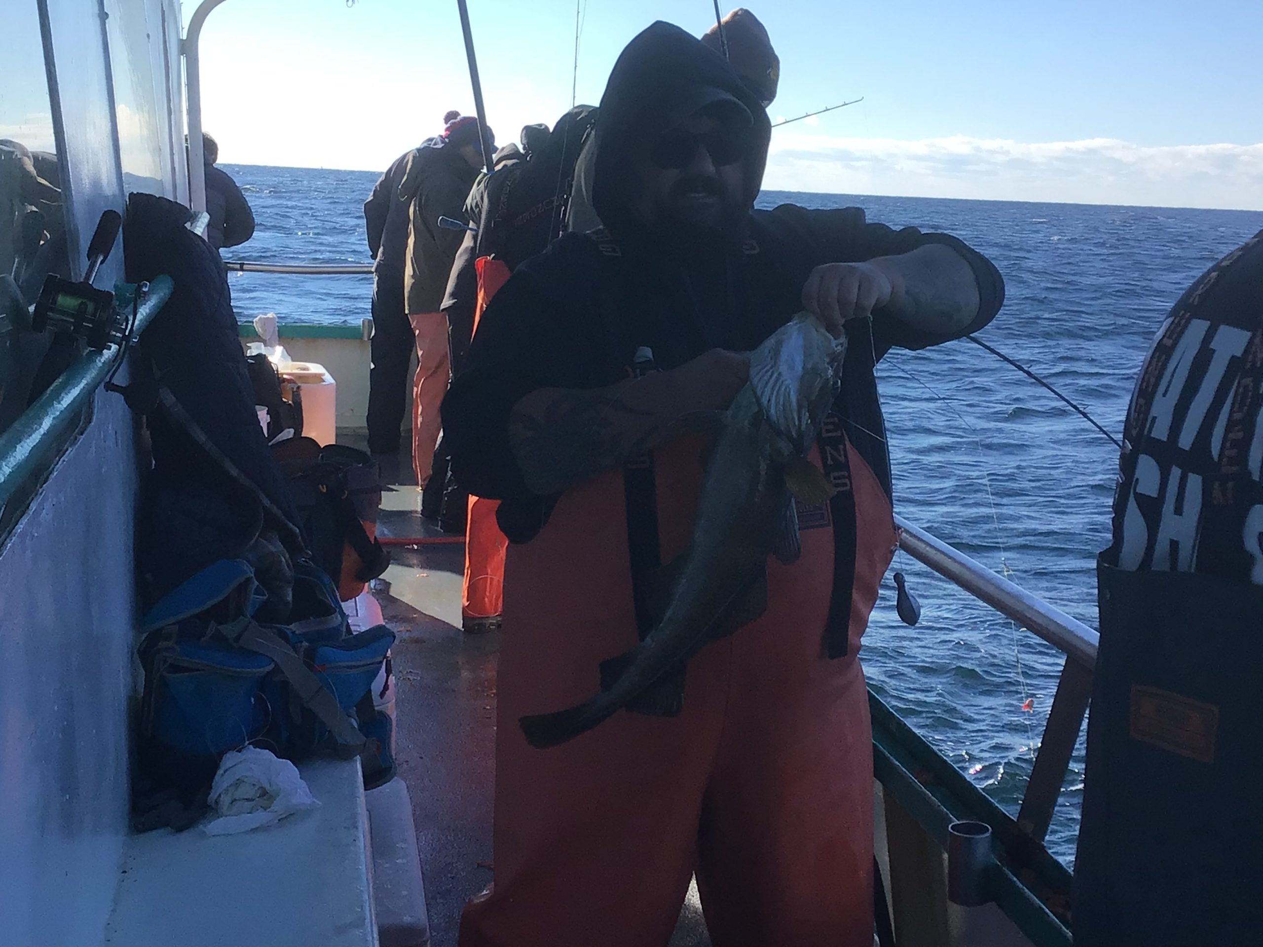 a person standing next to a body of water