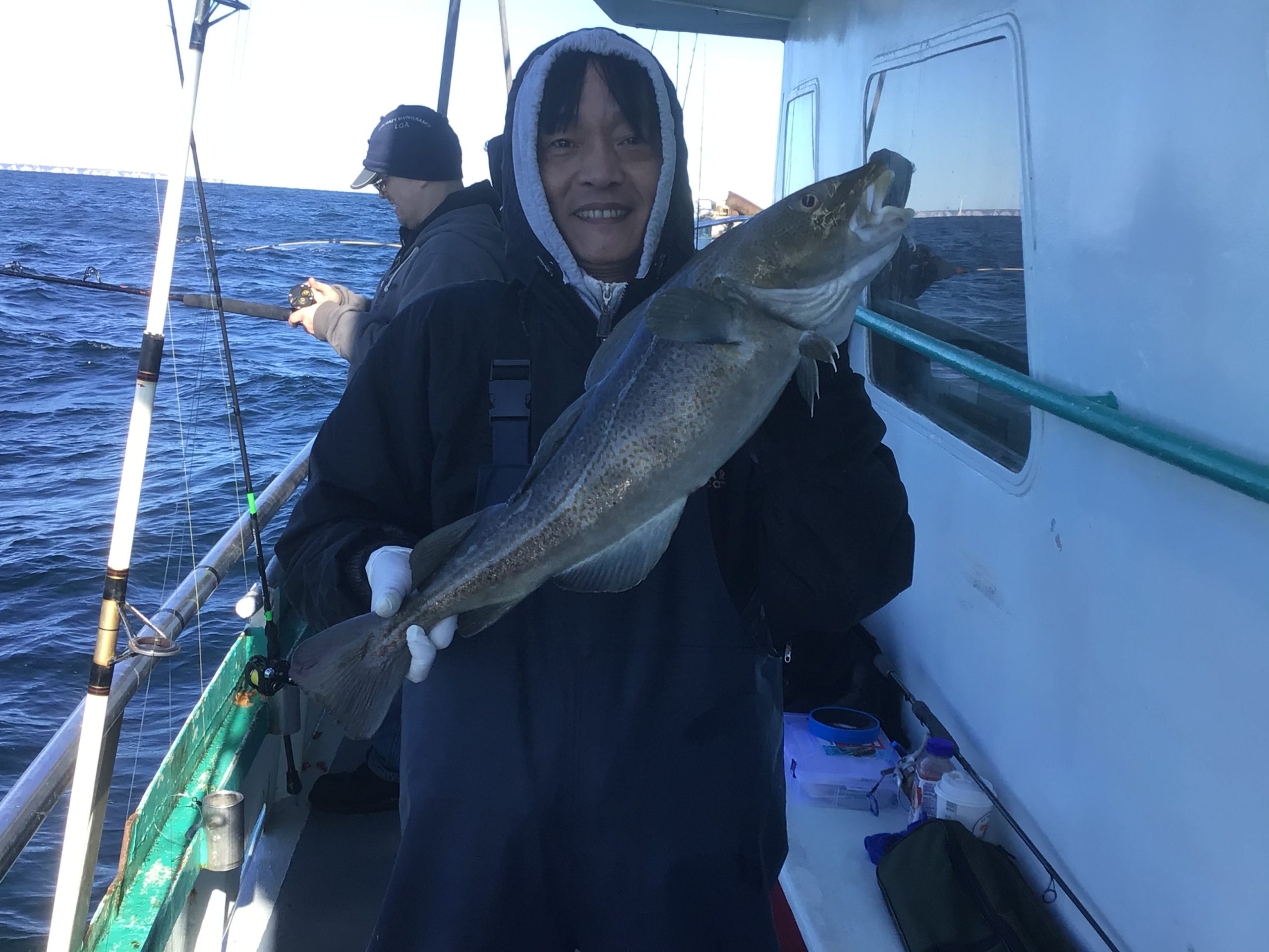 a person holding a fish in the water