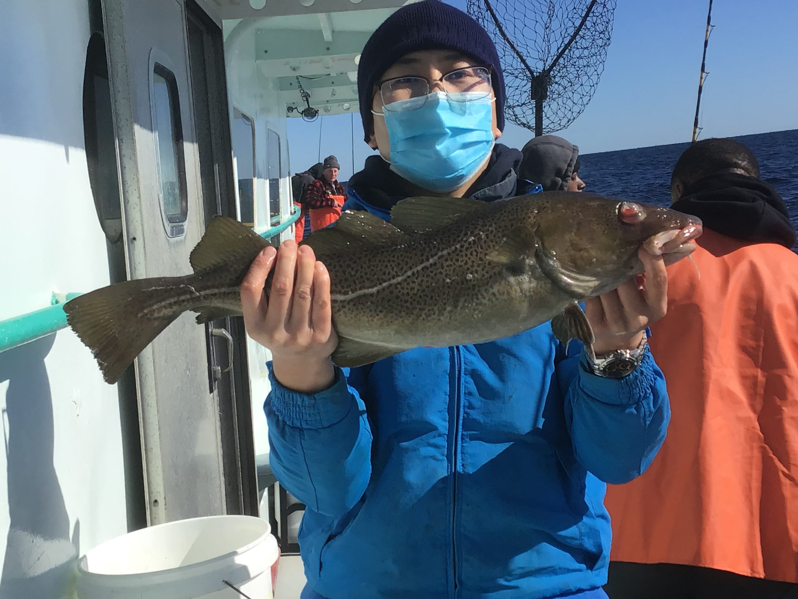 a person holding a fish