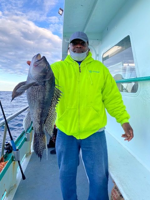 a man holding a fish