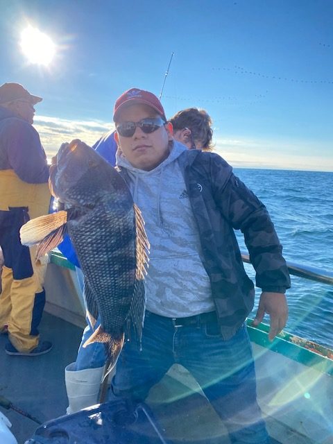 a couple of people that are standing in the water