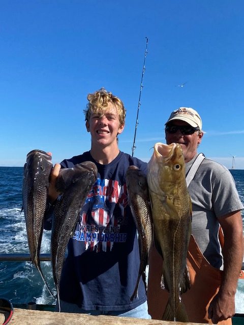 a person holding a fish