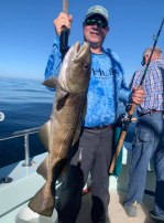 a person holding a fish