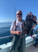 a man holding a fish