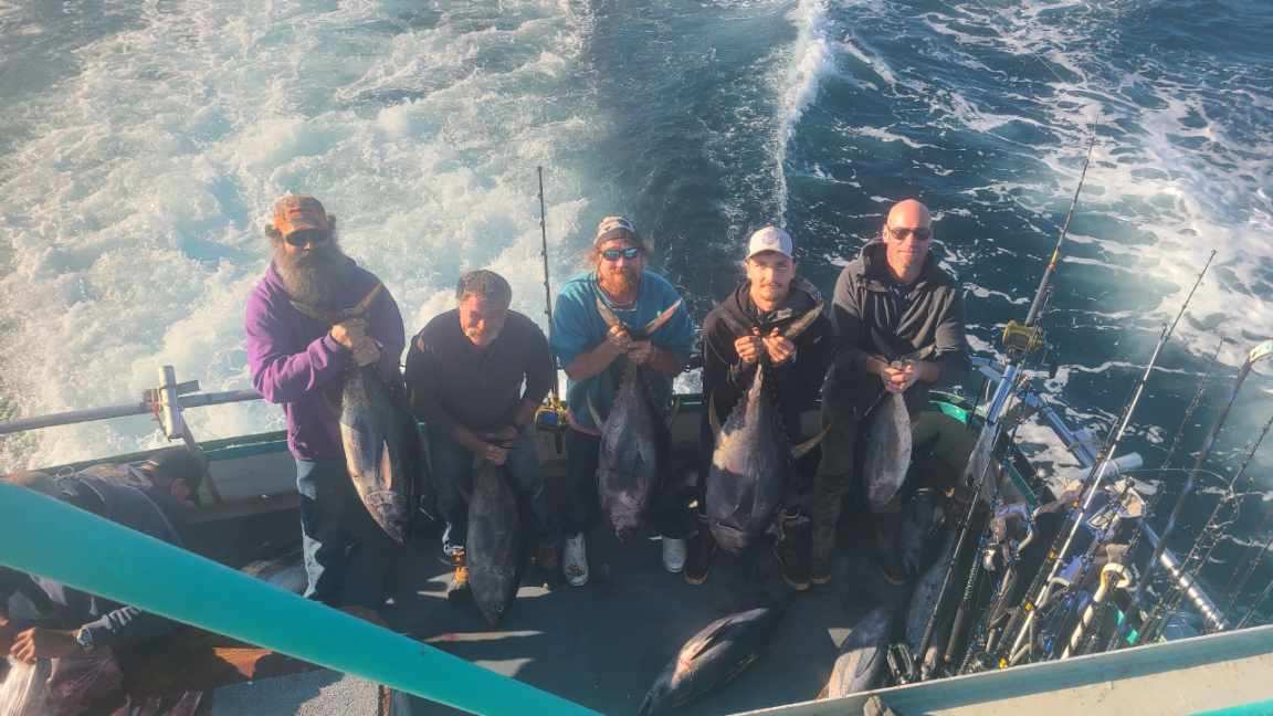 a group of people on a boat in the water
