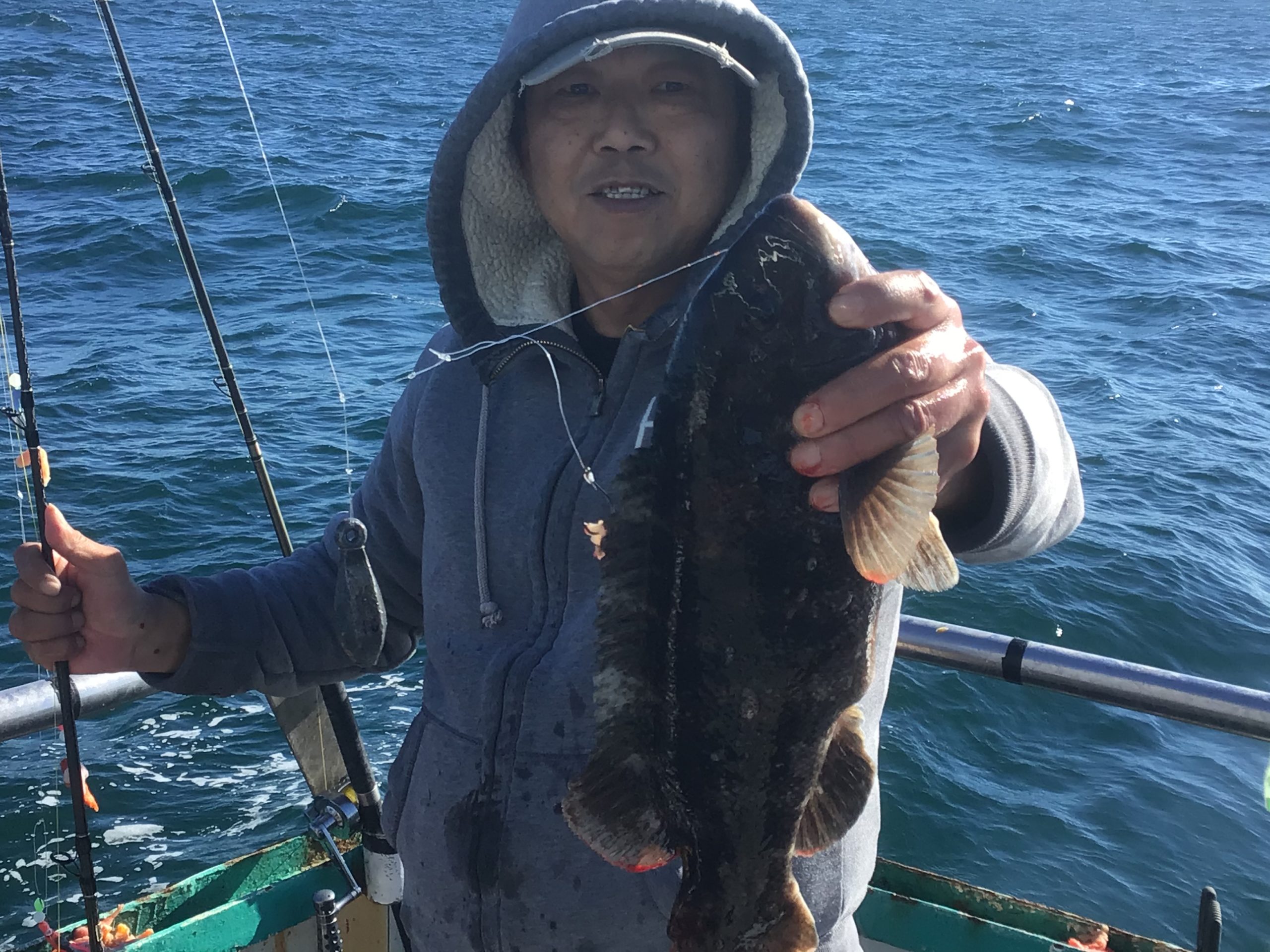 a person standing next to a body of water