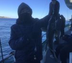 a couple of people that are standing in the snow