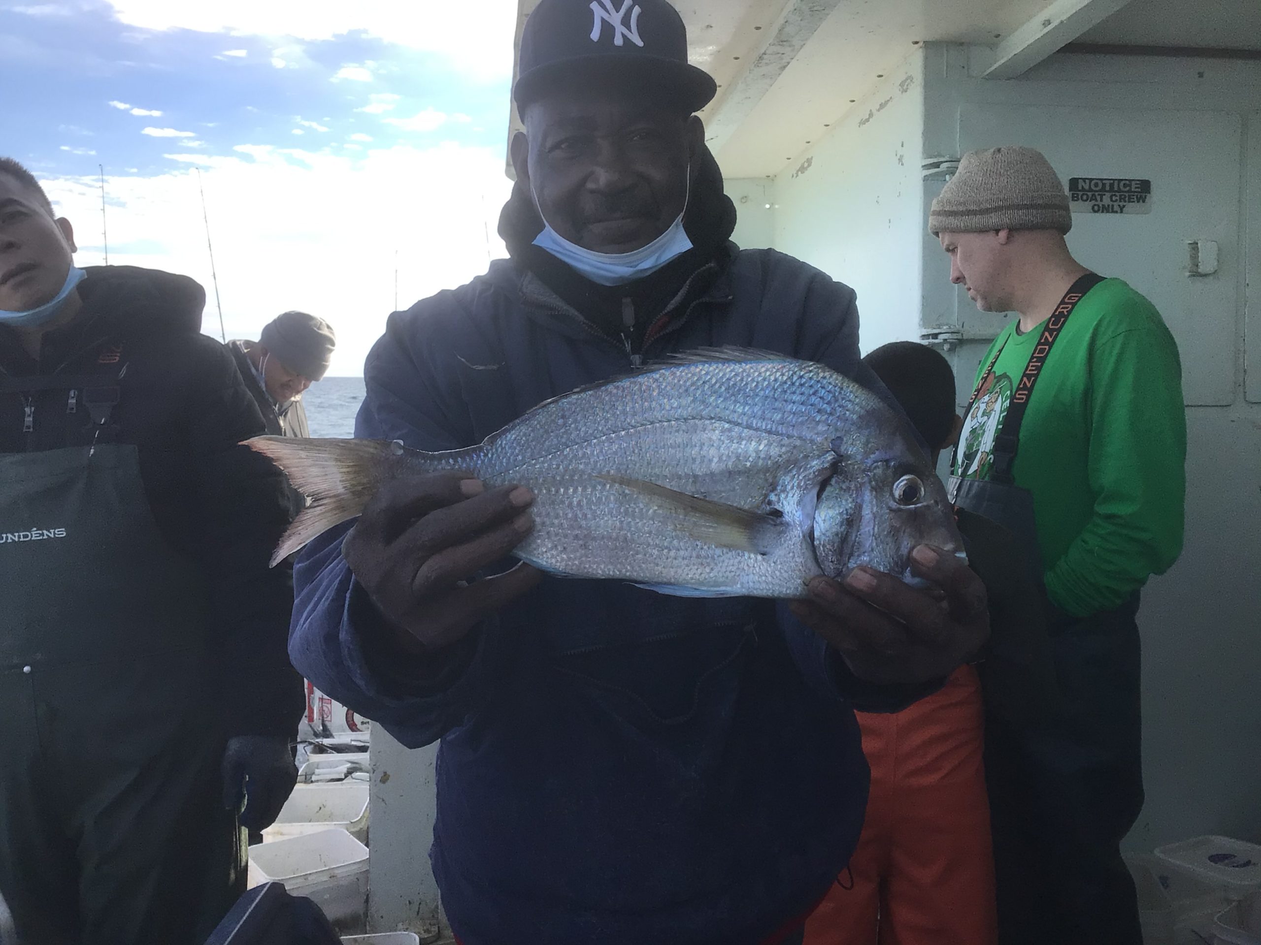 a person holding a fish