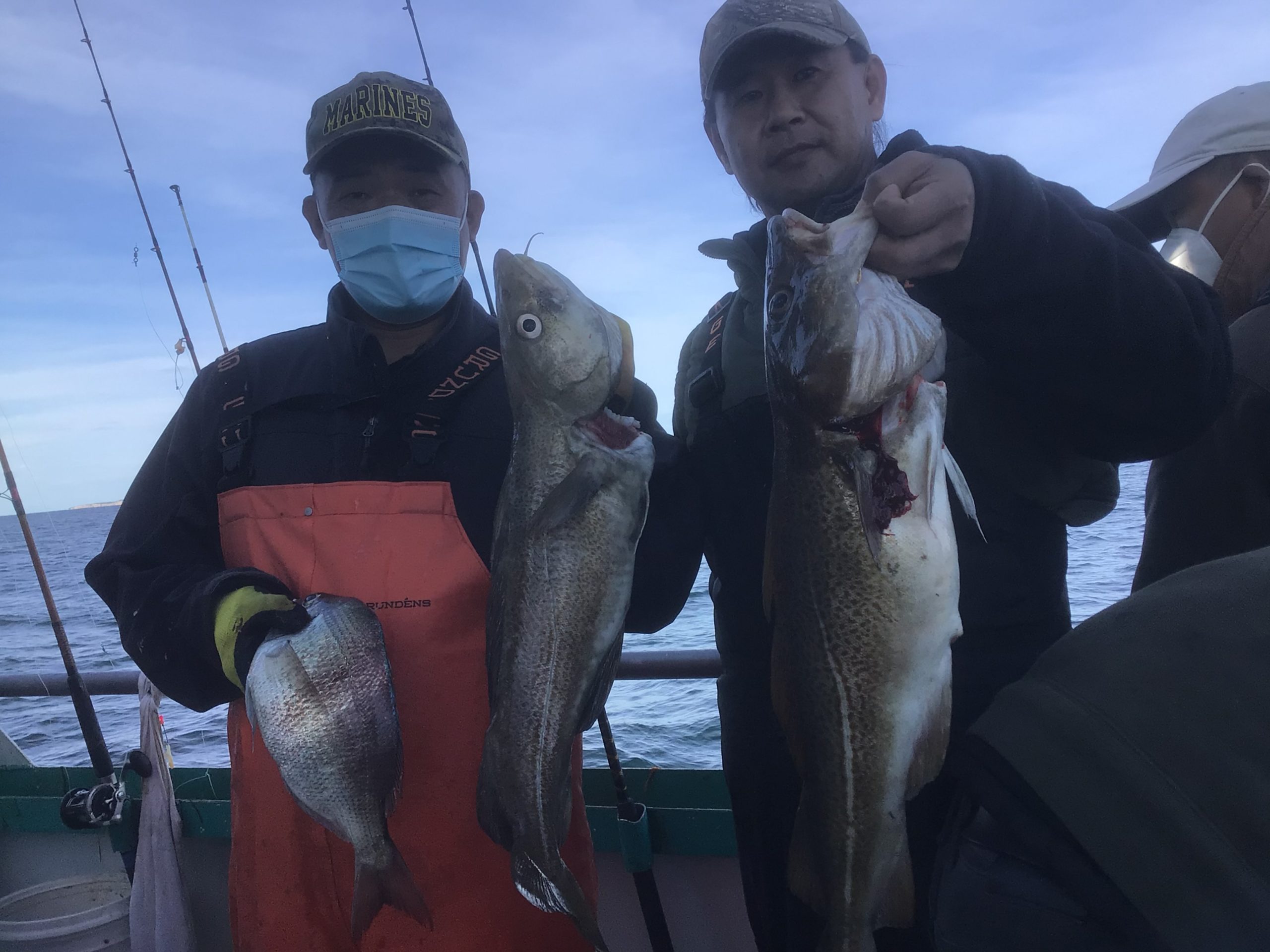 a man holding a fish