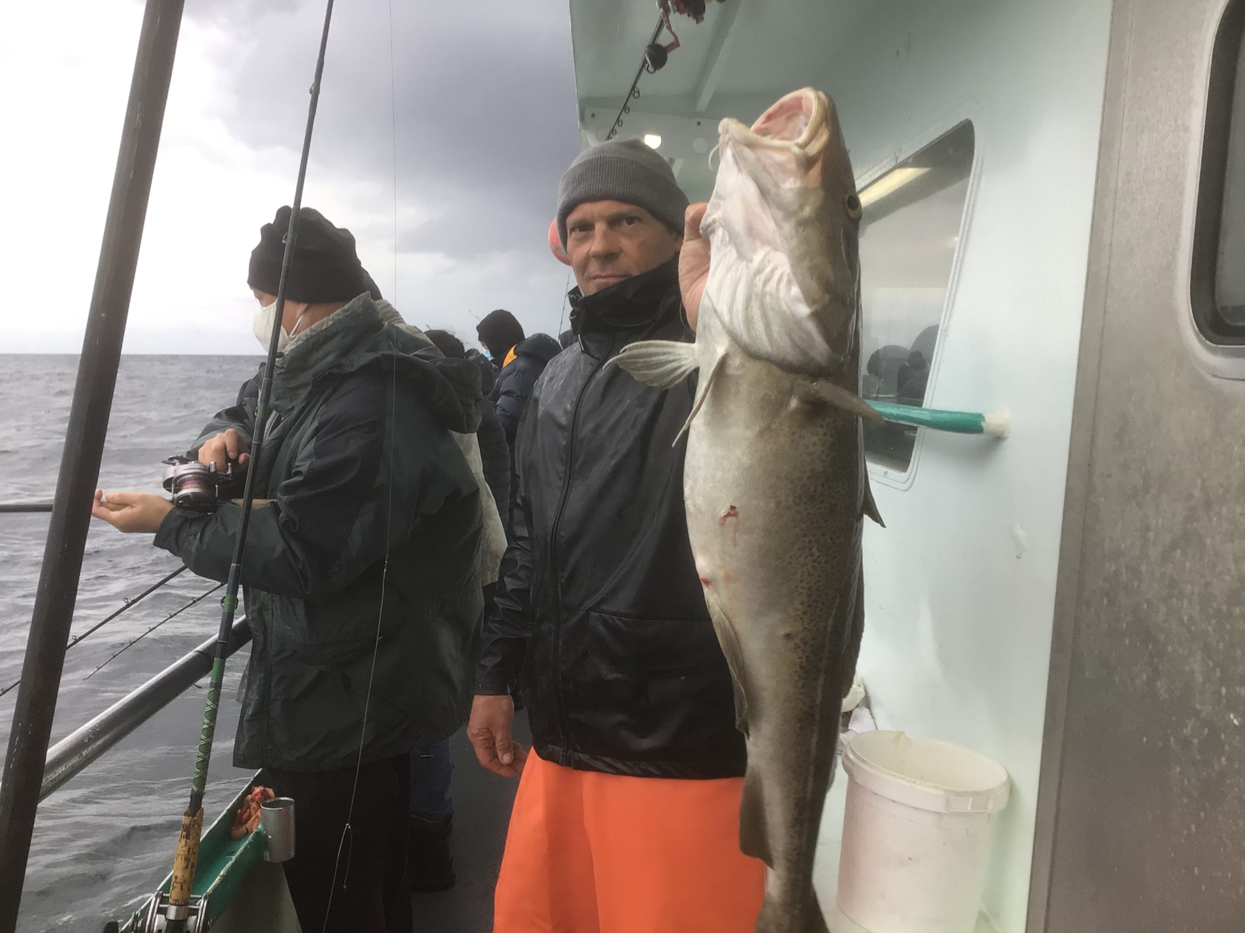 a person holding a fish