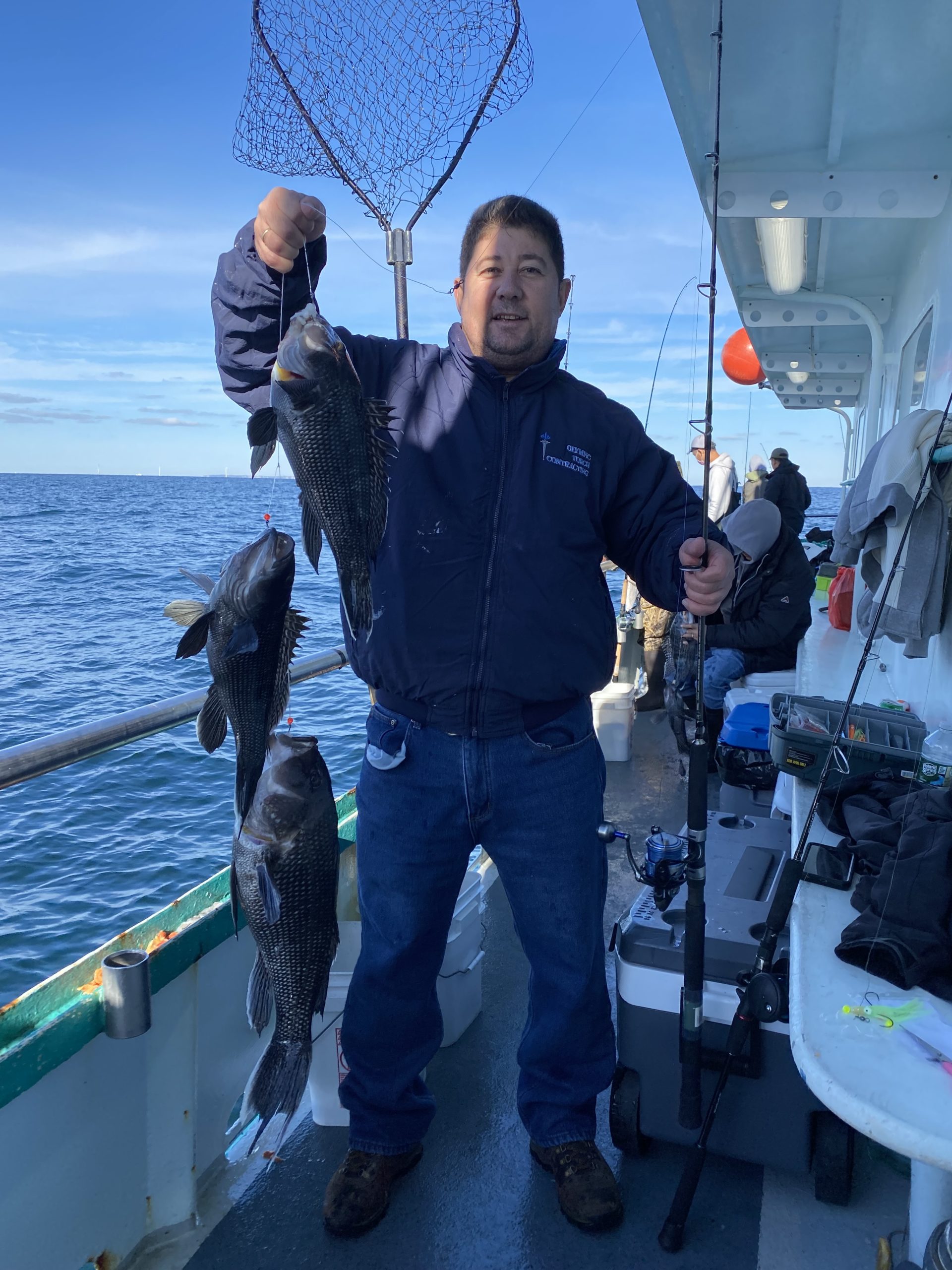 a man holding a fish in the water