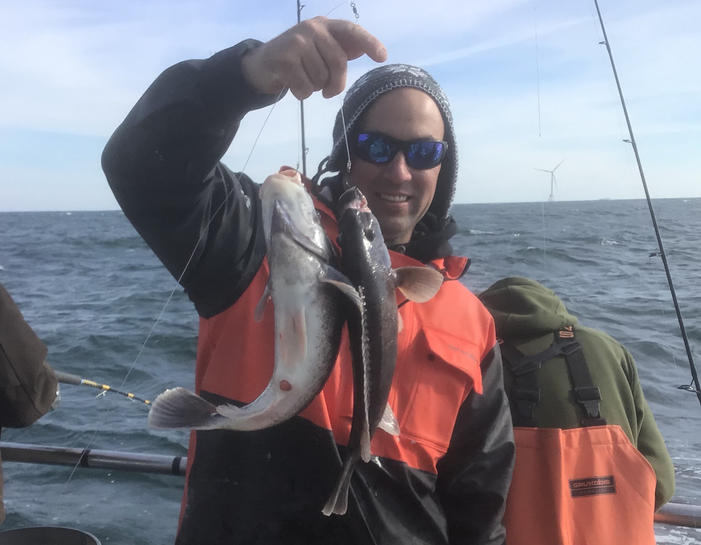a person standing next to a body of water