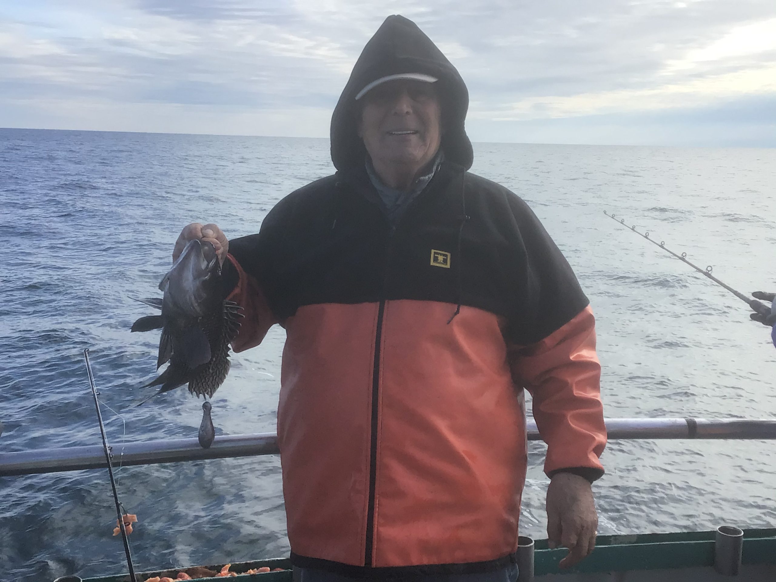 a person standing next to a body of water