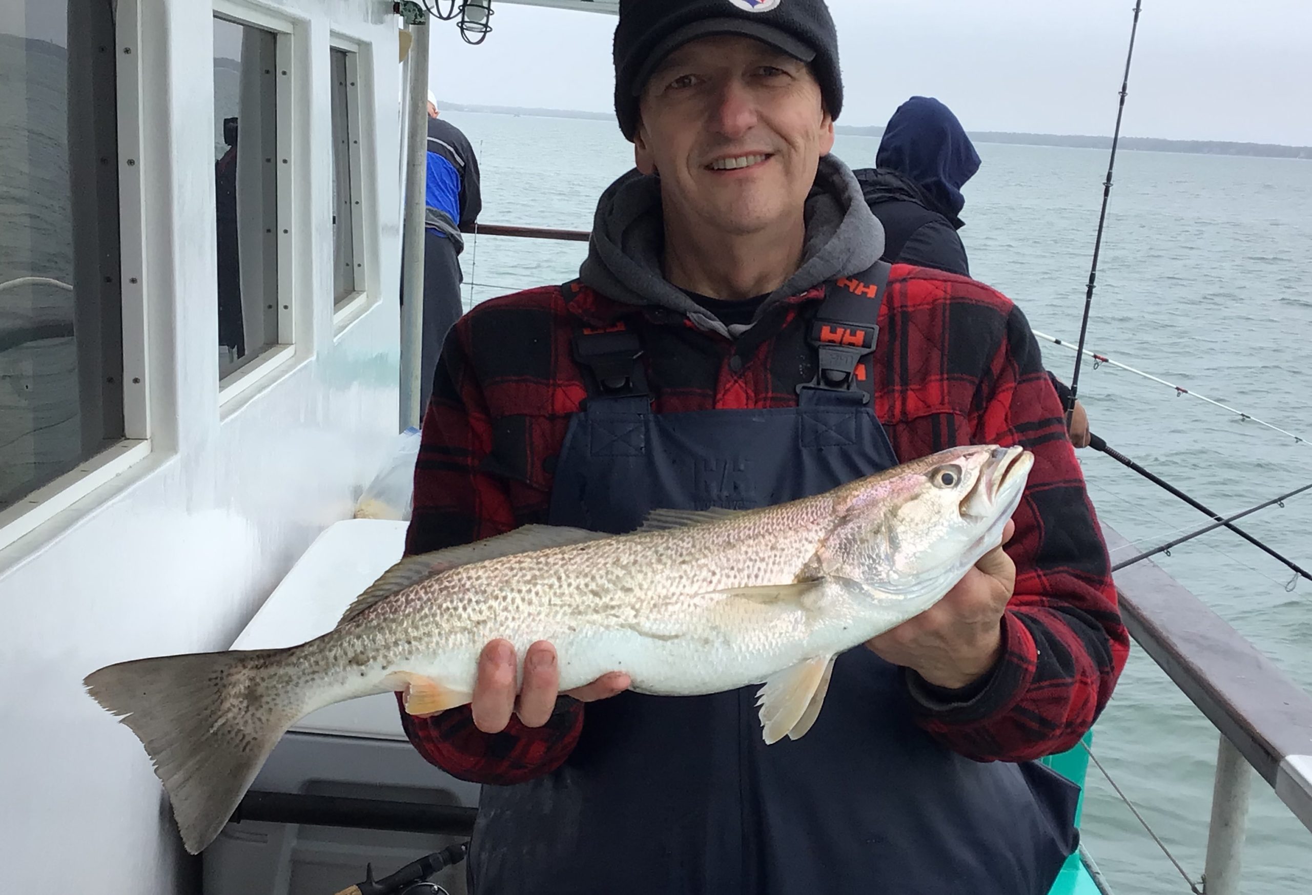 a man holding a fish