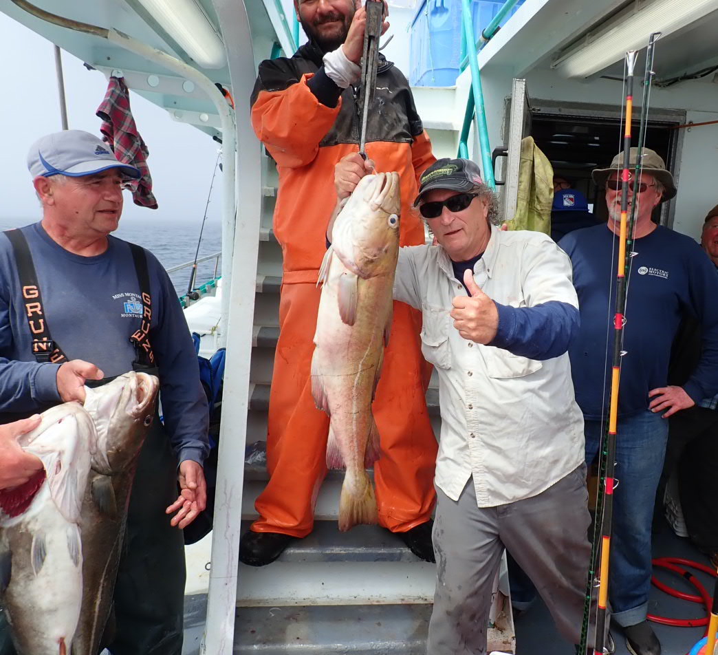a man holding a fish
