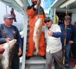 a man holding a fish