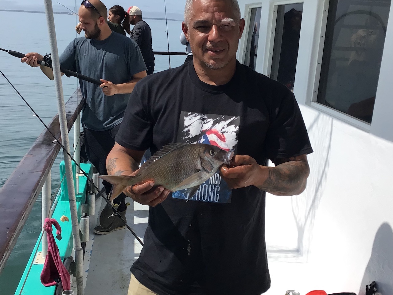 a person holding a fish