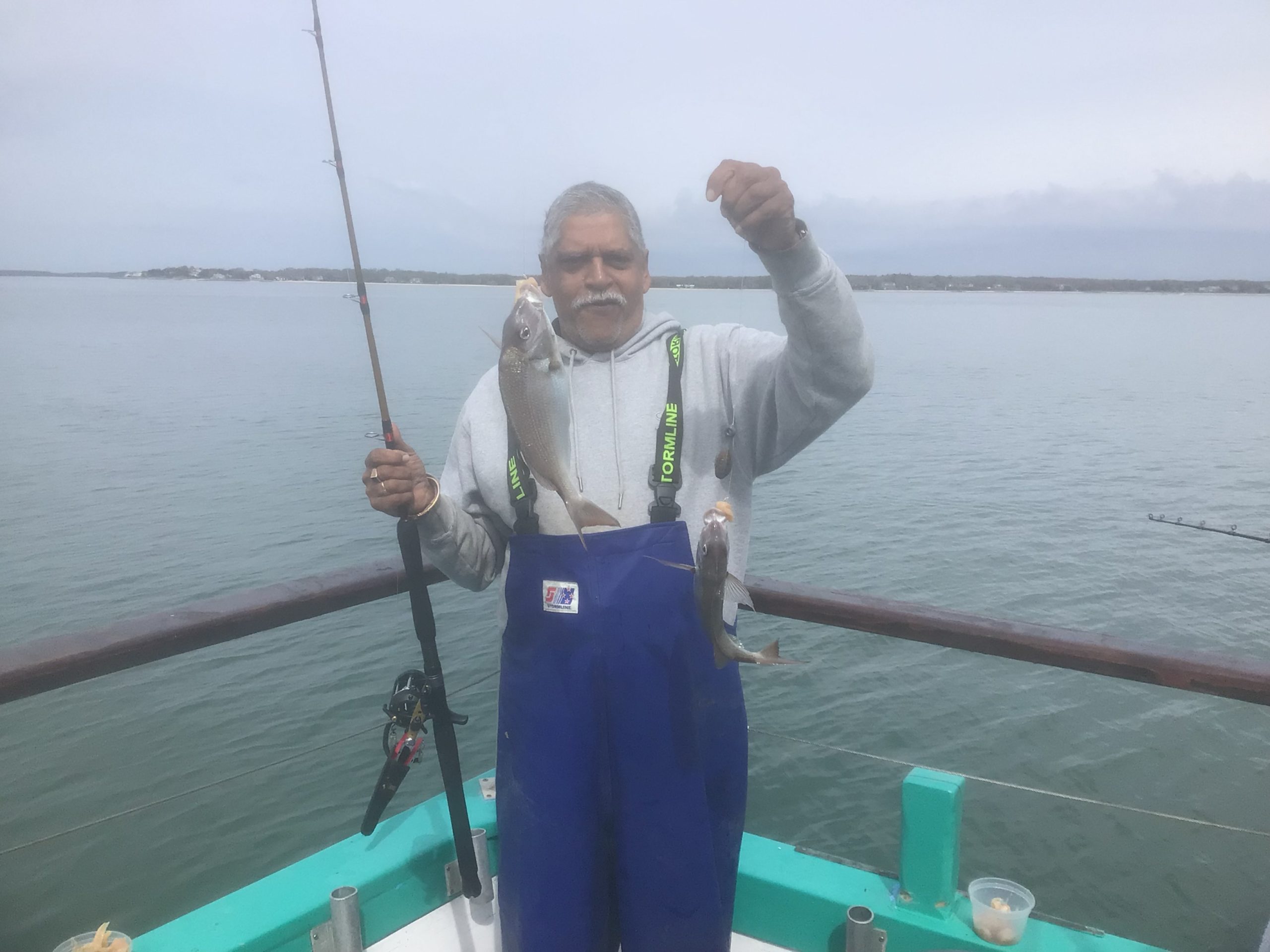 Varavara Rao standing next to a body of water