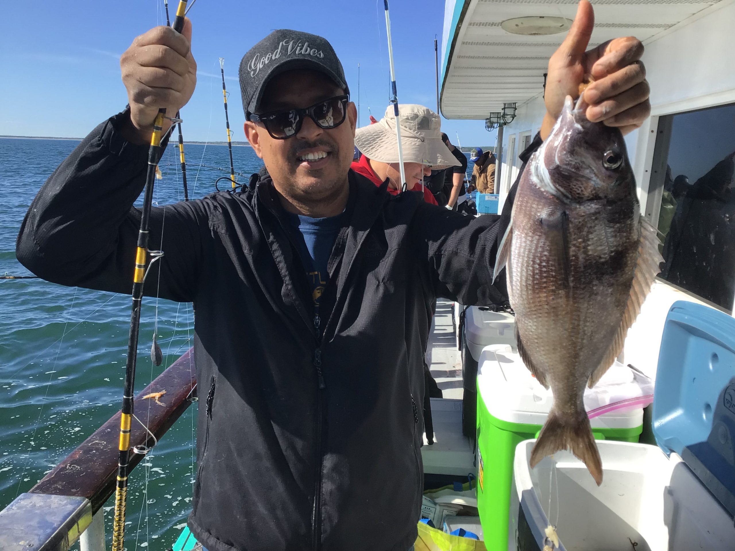 a man holding a fish in the water