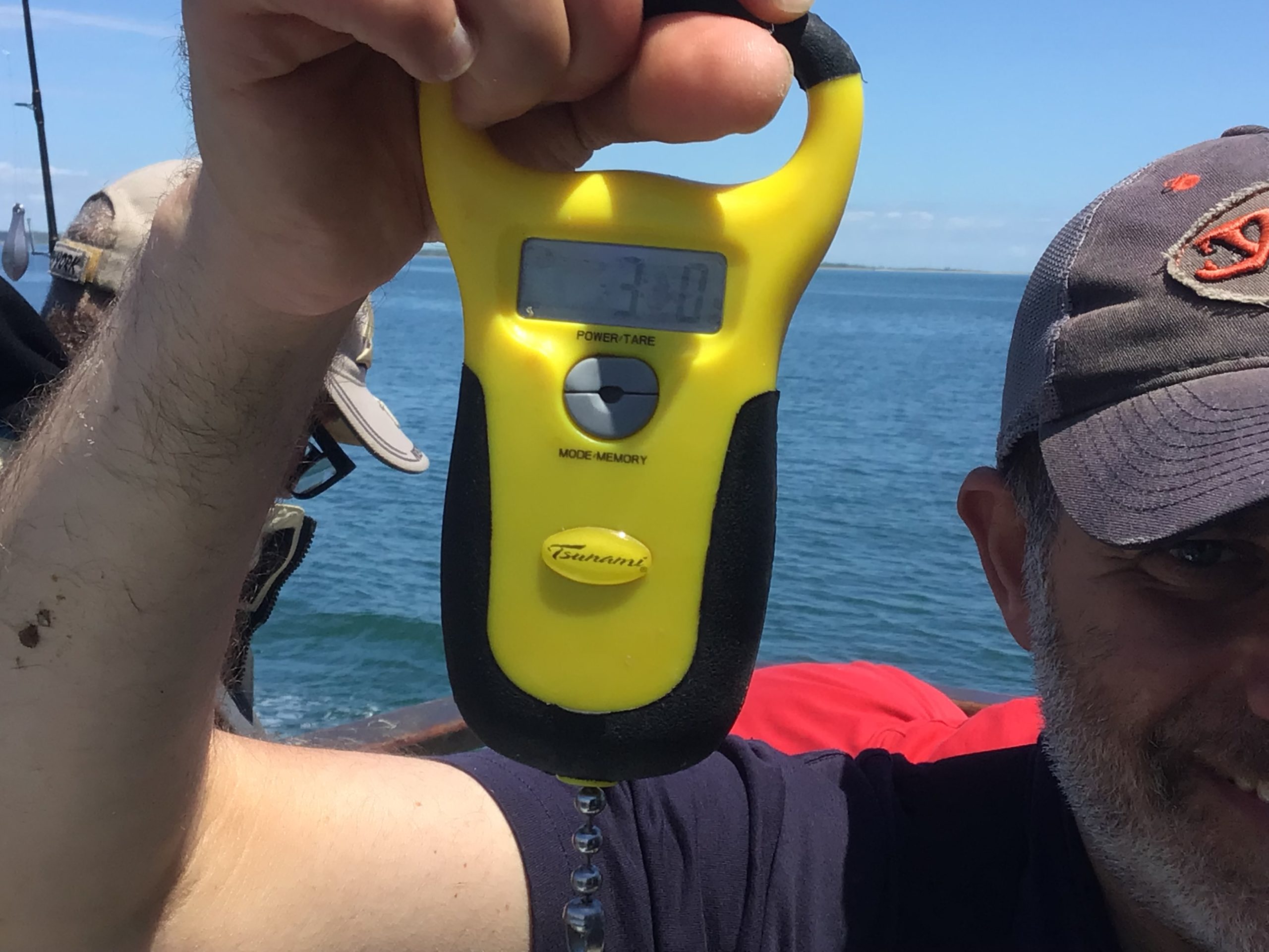 a person standing next to a body of water