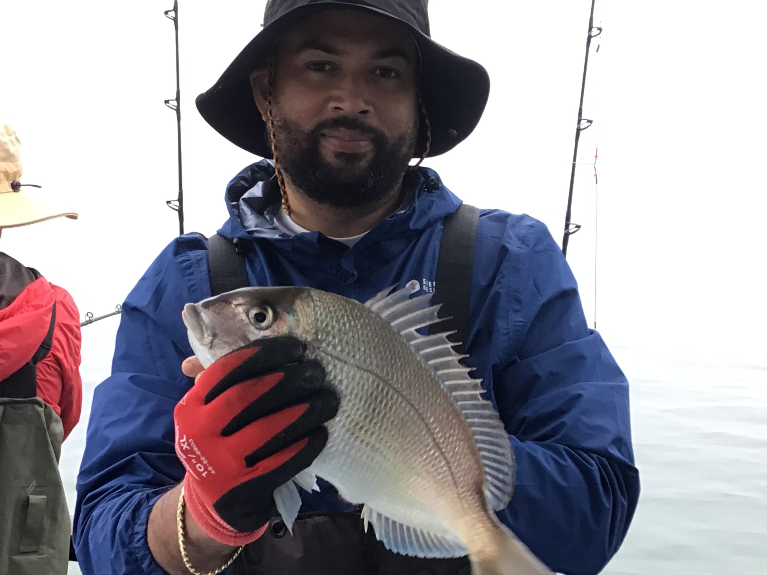 a person holding a fish