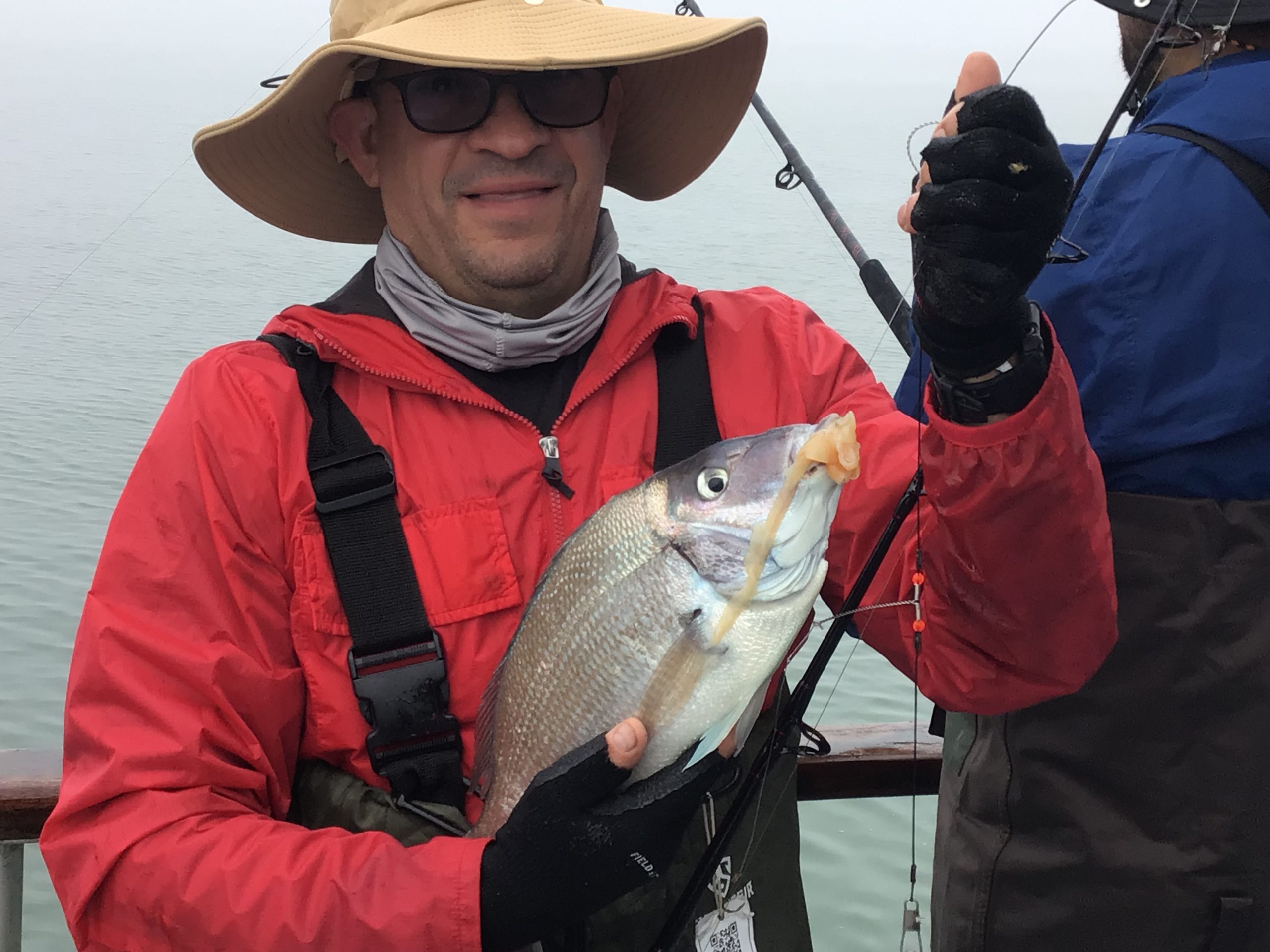 a man holding a fish