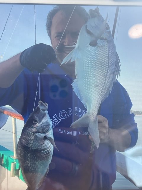 a person holding a fish