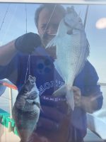 a person holding a fish