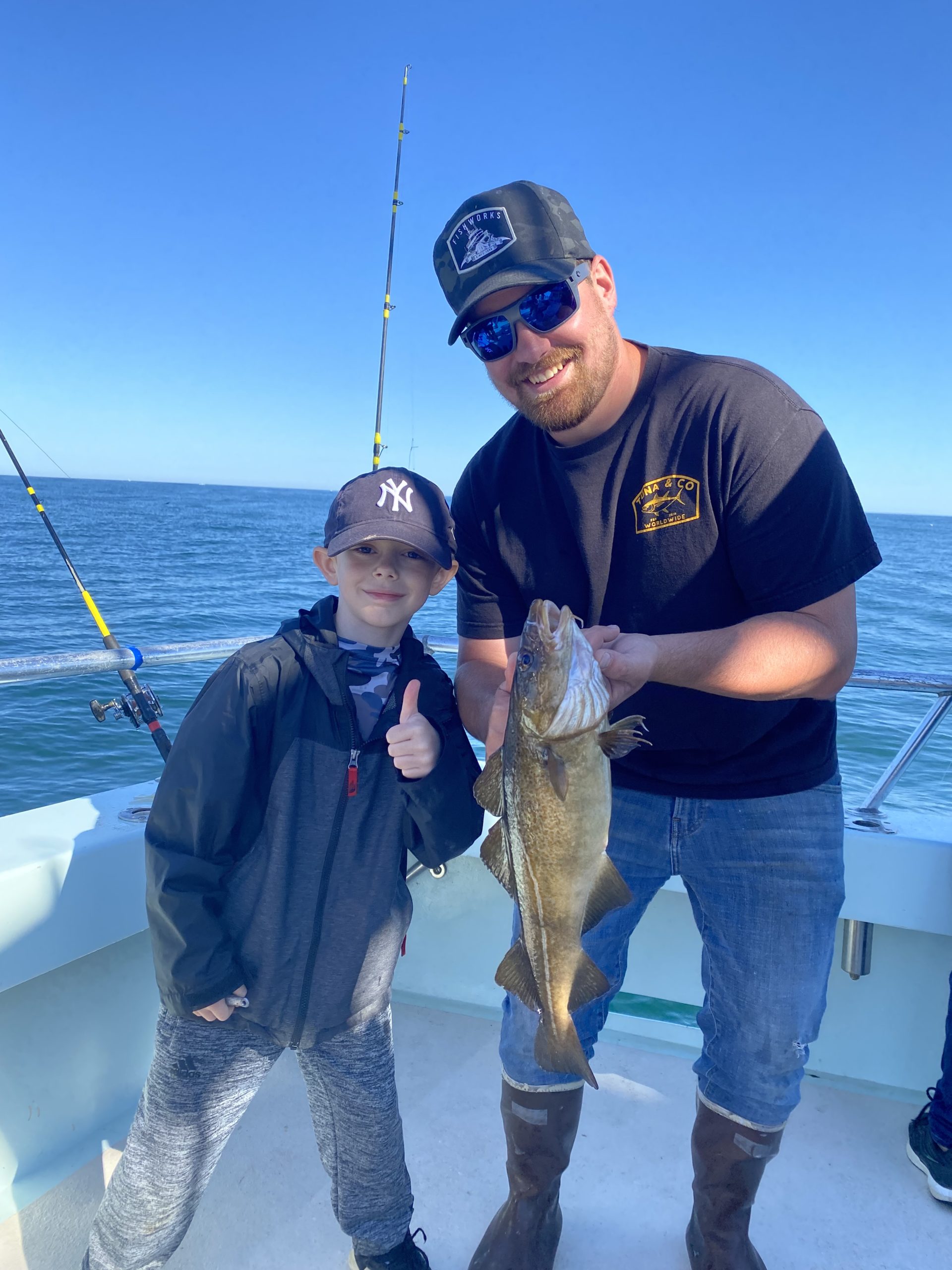 a man holding a fish in the water