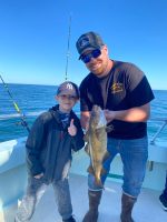 a man holding a fish in the water