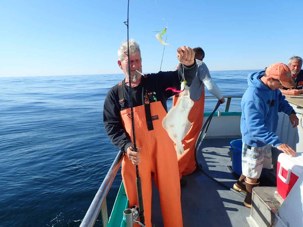 a couple of people on a boat in the water