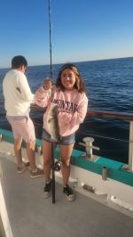 a person standing in front of a body of water