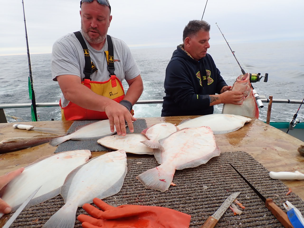 a man holding a fish in the water