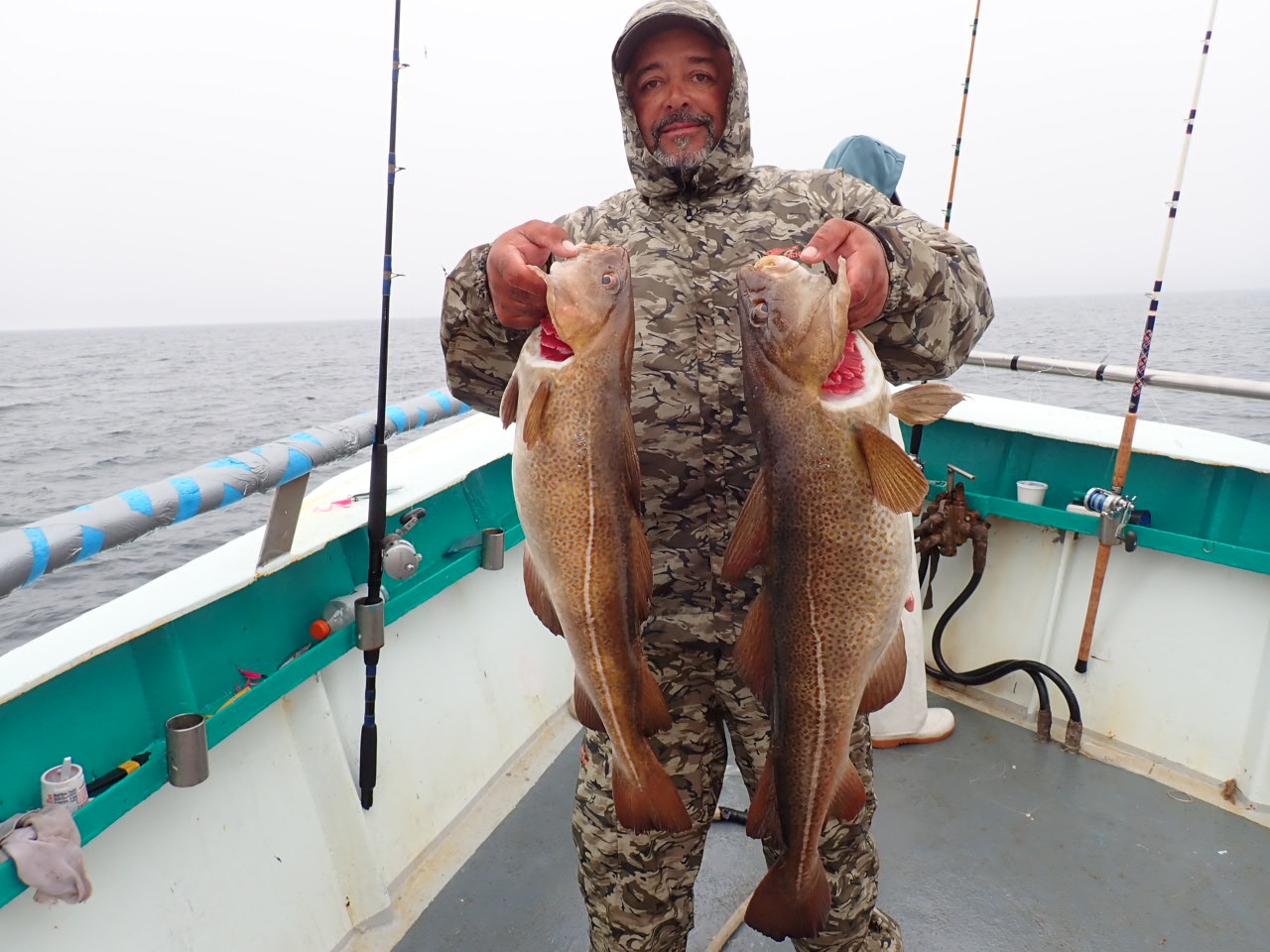 a man holding a fish
