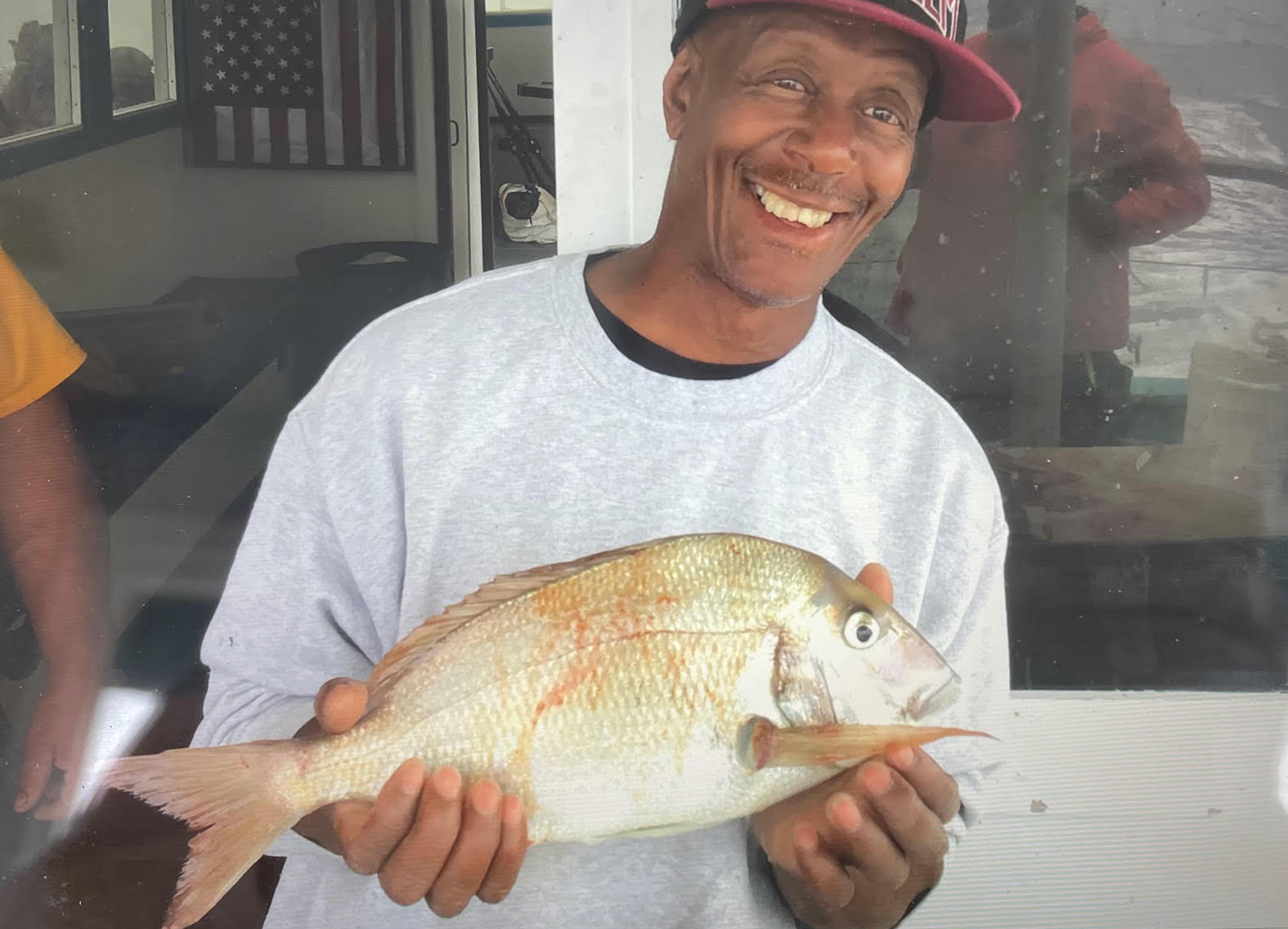 a man holding a fish