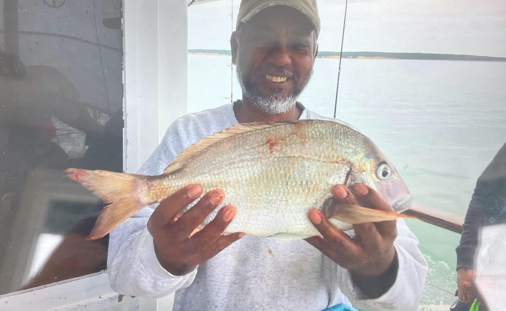 a man holding a fish