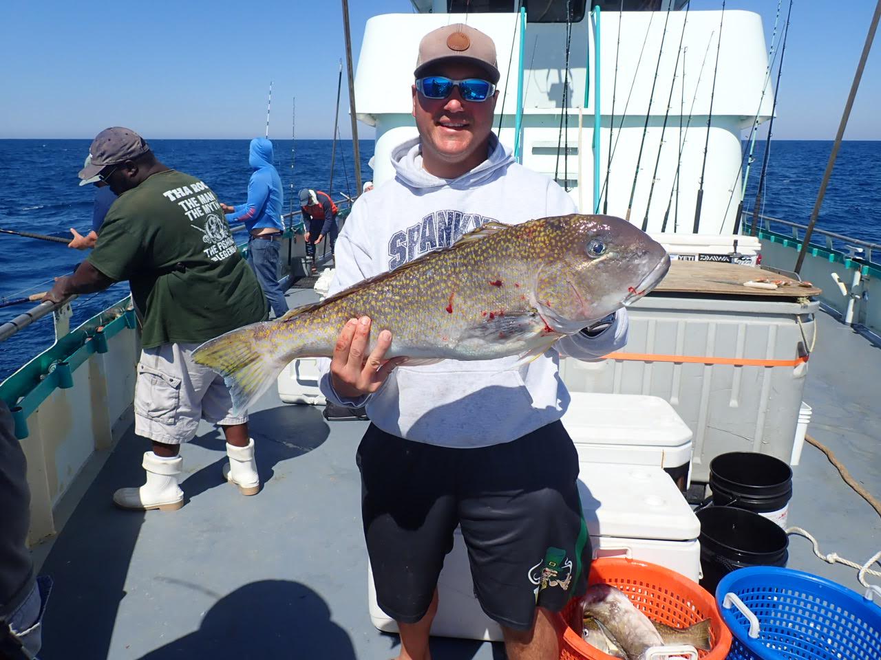 a person holding a fish