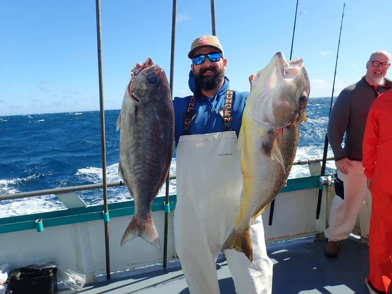 a man holding a fish