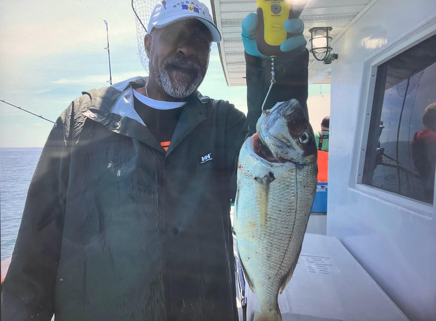 a man holding a fish