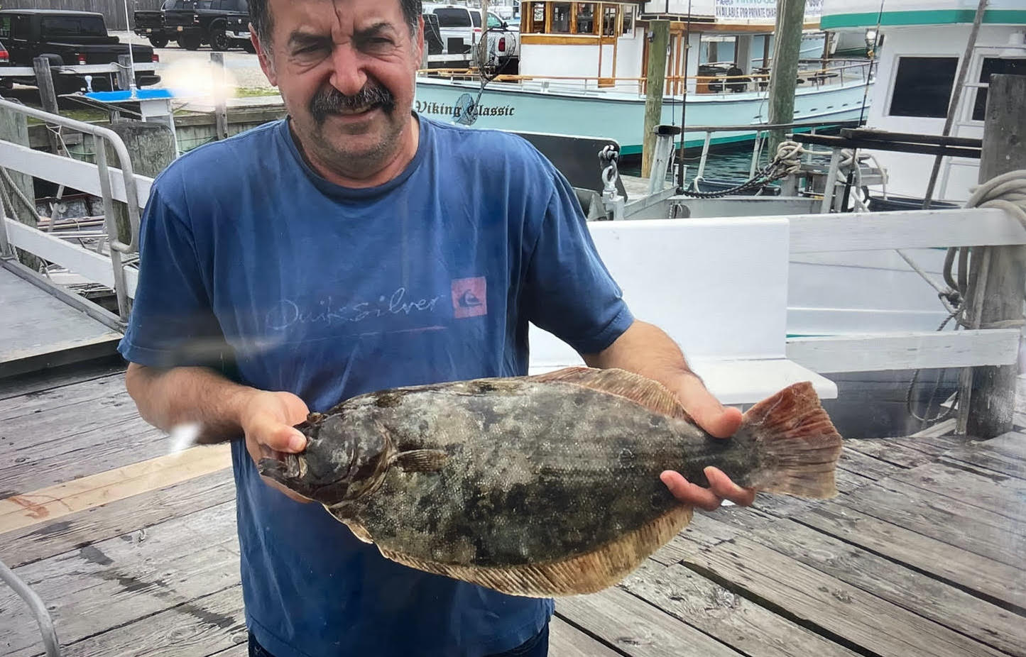 a man holding a fish