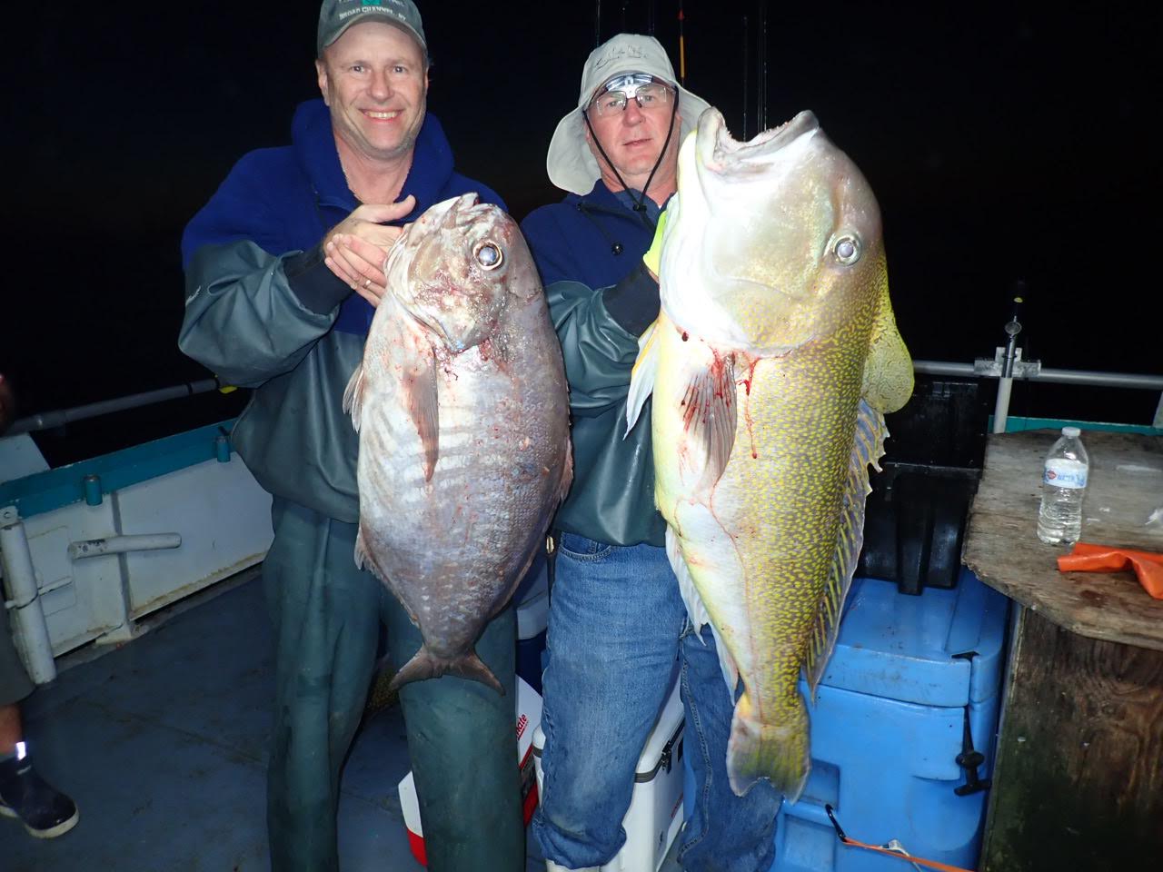a person holding a fish