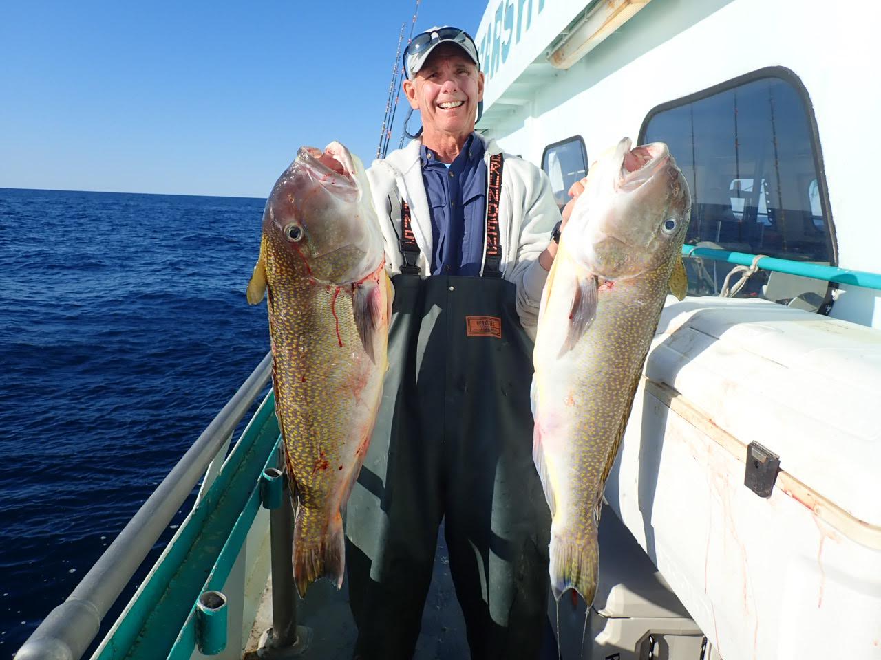 a man holding a fish