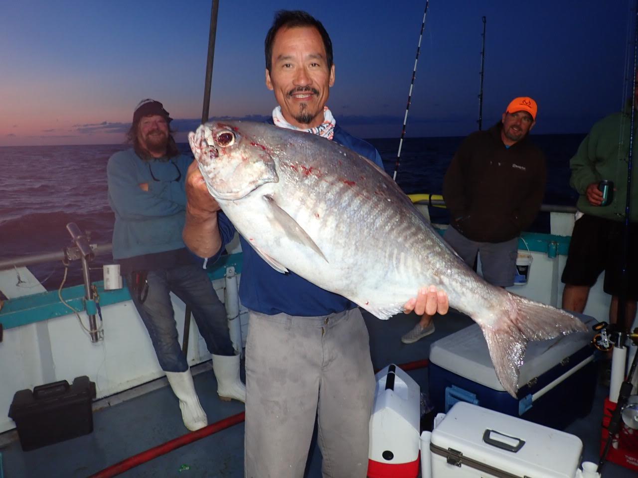 a person holding a fish