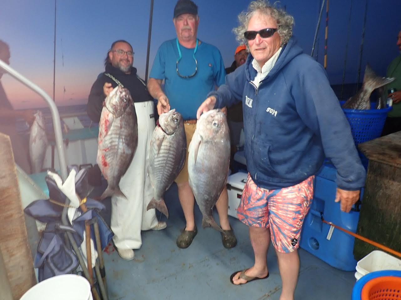 a person holding a fish