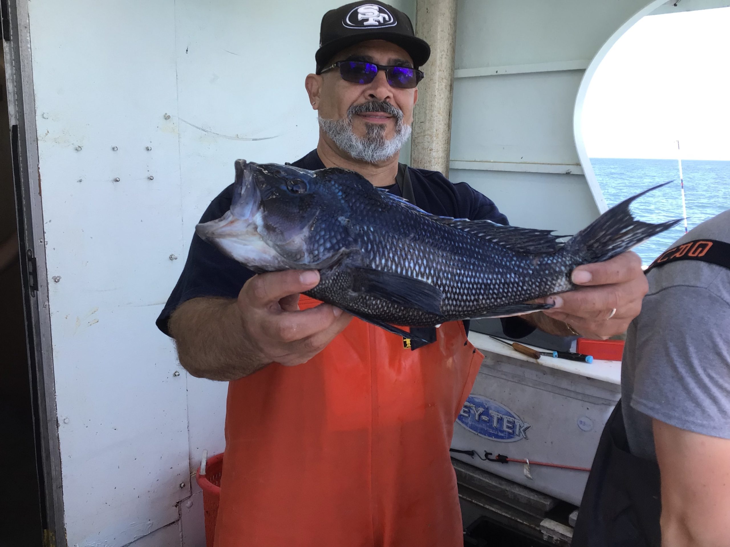 a man holding a fish