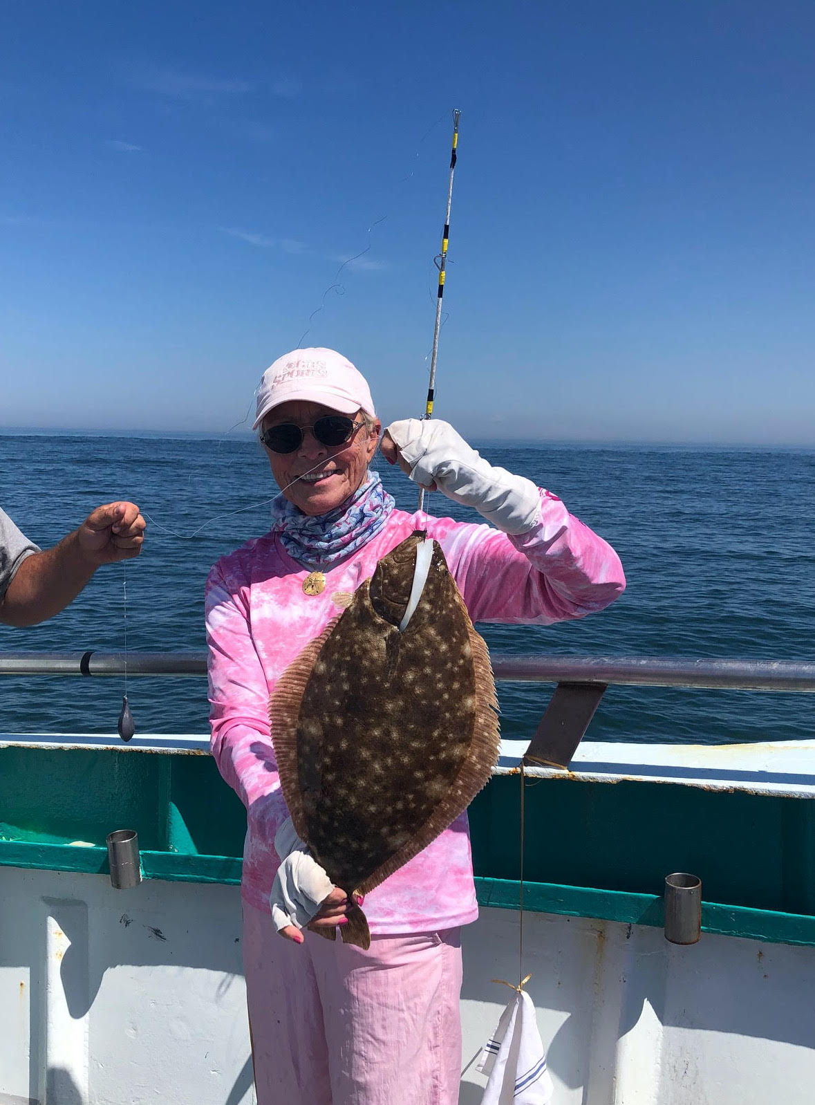 a person sitting on a boat in a body of water