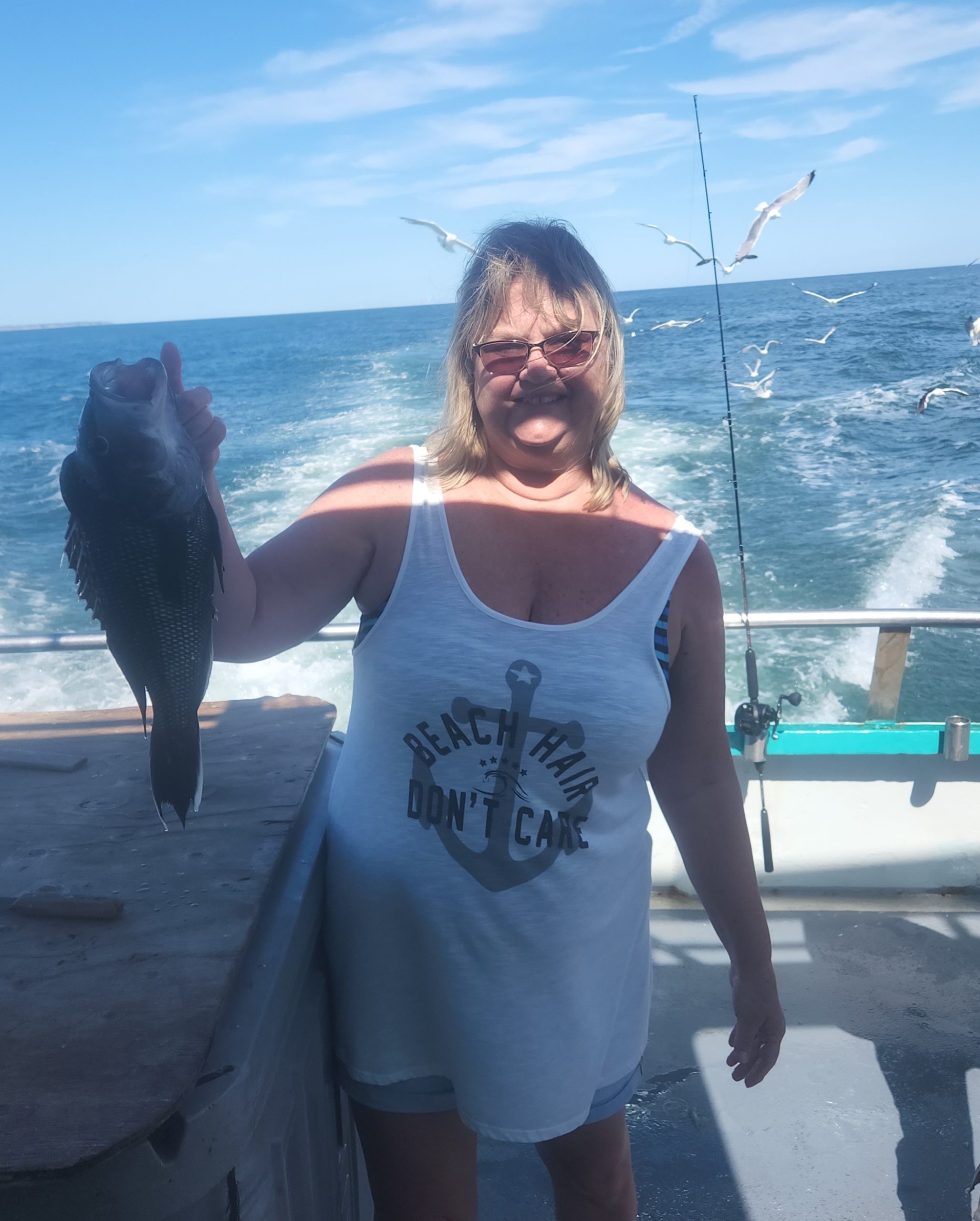 a person standing next to a body of water