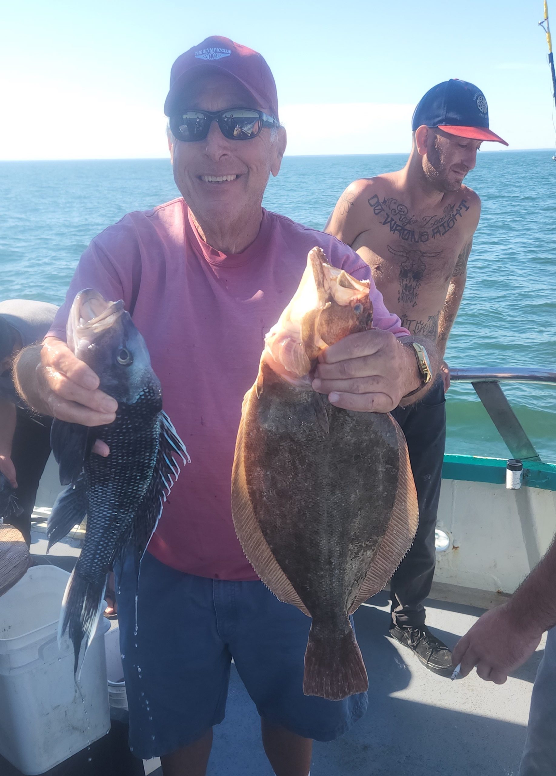 a person holding a fish in the water